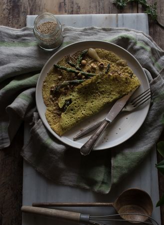 Served vegetarian crepe with oats and asparagus