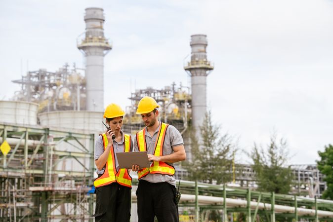 Engineer worker checking project at petrochemical factory or refinery oil plant industrial.