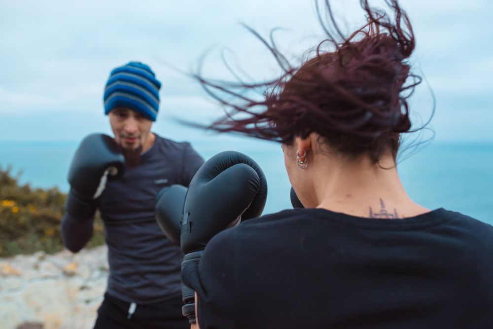 Boxers exercising on cliff