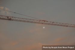 Crane under cloudy sunset sky 48Qa7b