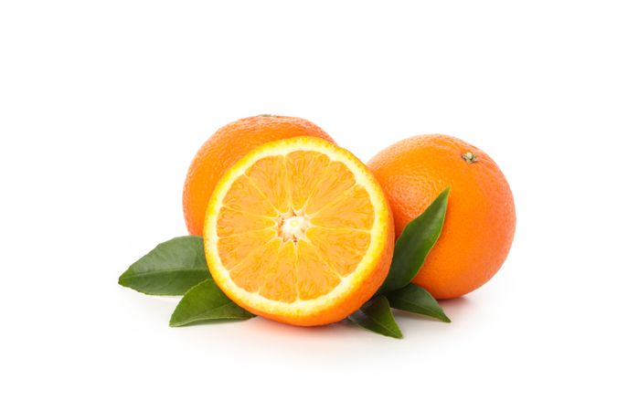 Group of ripe mandarins isolated on light background