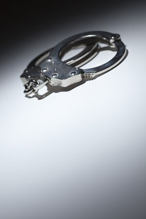 Abstract Pair of Handcuffs Under Spot Light - Text Room