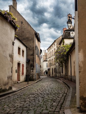 Empty streets of the medieval city of Beaune in Burgundy. The stormy sky