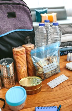 Emergency backpack equipment organized on the table