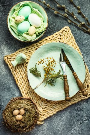 Pastel green plates with decorative eggs