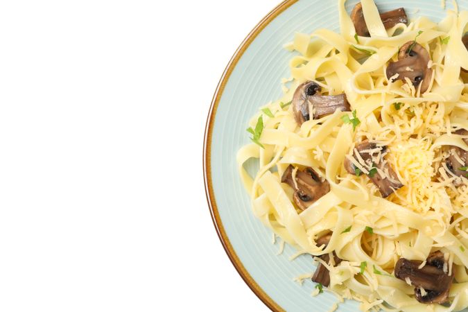 Plate with pasta, cheese and mushrooms isolated on blank background