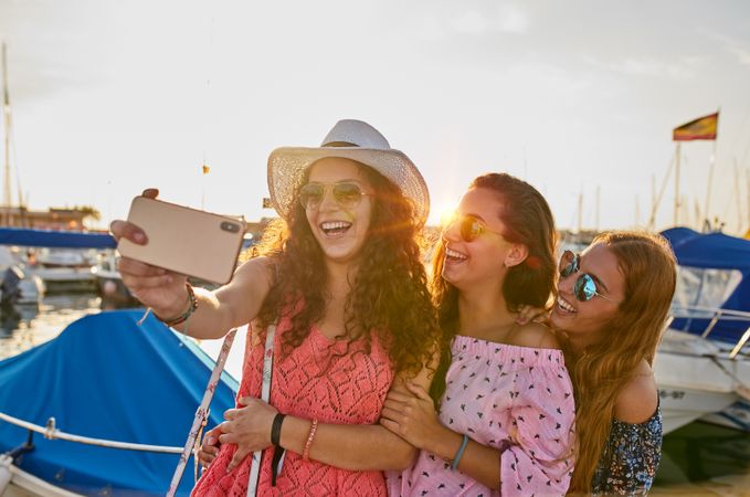 Optimistic fellows bonding and shooting selfie in summer
