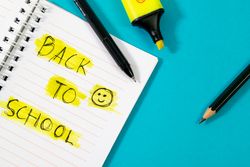 Notebook with writing Back to School with green stabilo