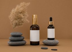 Beauty products assorted on grey stones