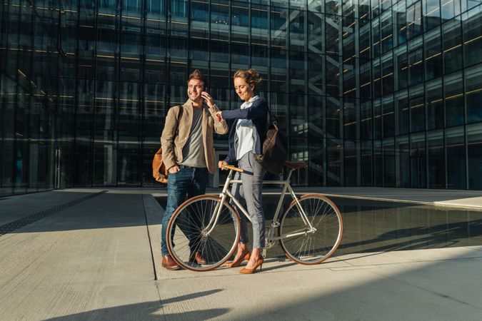 Businesspeople talking on street after work