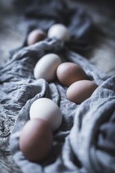 Raw eggs on tablecloth