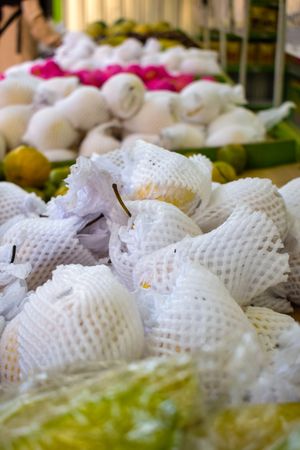 Fruits wrapped and for sale in produce market