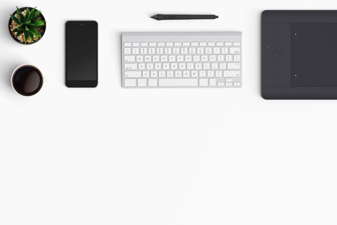 Modern workspace with coffee cup, smartphone, paper, notebook and tablet copy space