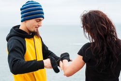 Kickboxers bandaging hands before outdoor training