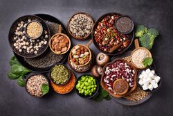 Bowls of healthy grains and vegetables, top view