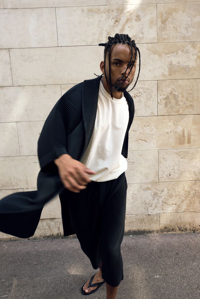 Trendy Black man posing on street