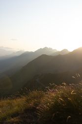 Mysterious mountain high in row in sunlight