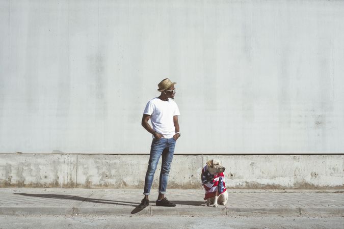 Man and dog in American flag on street