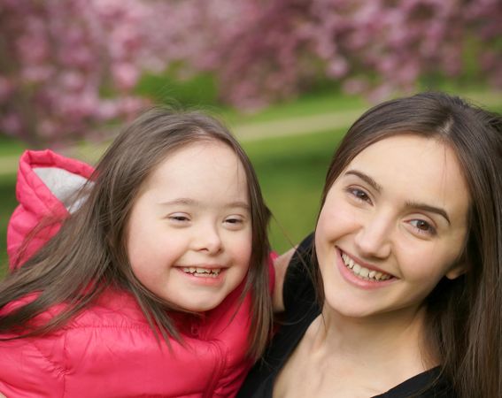 Happy siblings playing in a park together