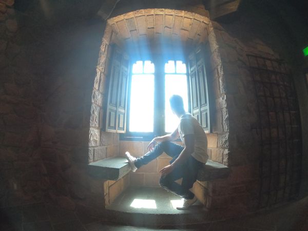 Side view of young man sitting by the window in Japan