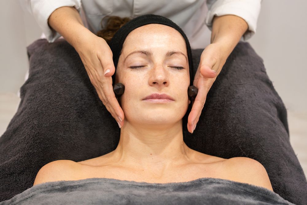 Woman receiving facial in salon