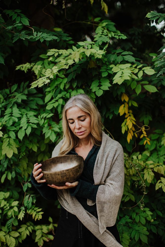Romantic woman with musical bowl in castle