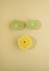 Top view of two lime slices and one lemon