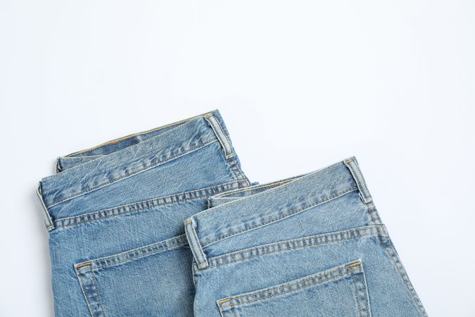 Jeans on light background, space for text