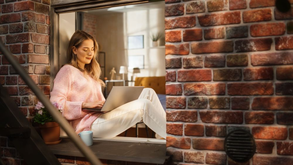 Female Blogger Writing an Article About Wellbeing While Enjoying Fresh Air and Warm Sun