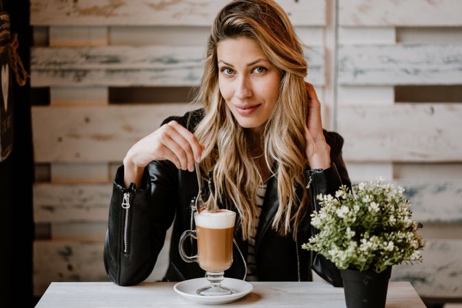 Woman drinking coffee from a glass