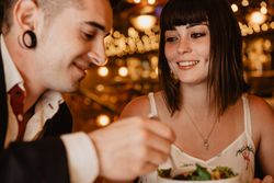 Young couple eating salad on date