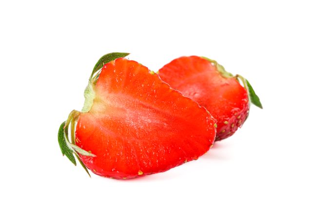 Strawberries isolated on light background. Summer sweet fruits and berries