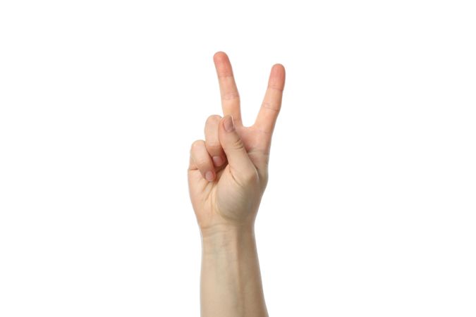 Female hand showing two fingers, isolated on blank background