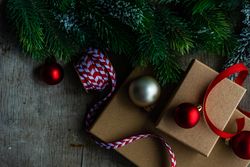 Christmas present box with baubles and ribbon