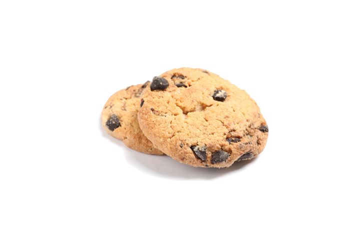 Delicious chocolate chip cookies on blank background
