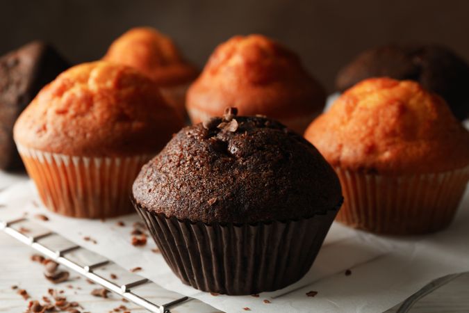 Composition with tasty muffins on wooden background