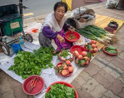 Gyeongju, South Korea - August, 05 2017: Elderly Asian woman selling fruits and vegetables