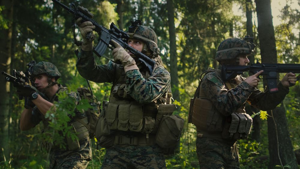 Military Operation in Action, Squad Running in Formation Through Dense Forest. Side View Long Shot.