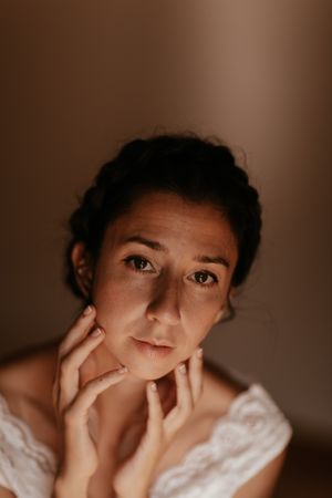 woman sitting in dark room