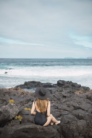 Sensual female near stormy sea