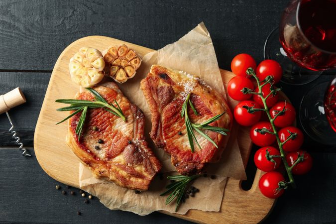 Composition with fried steaks and wine. Grilled food