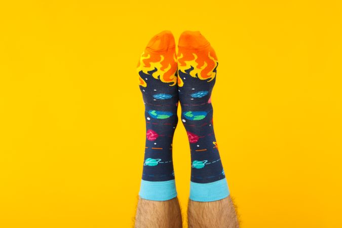 Concept of clothes for legs - socks, socks on male legs