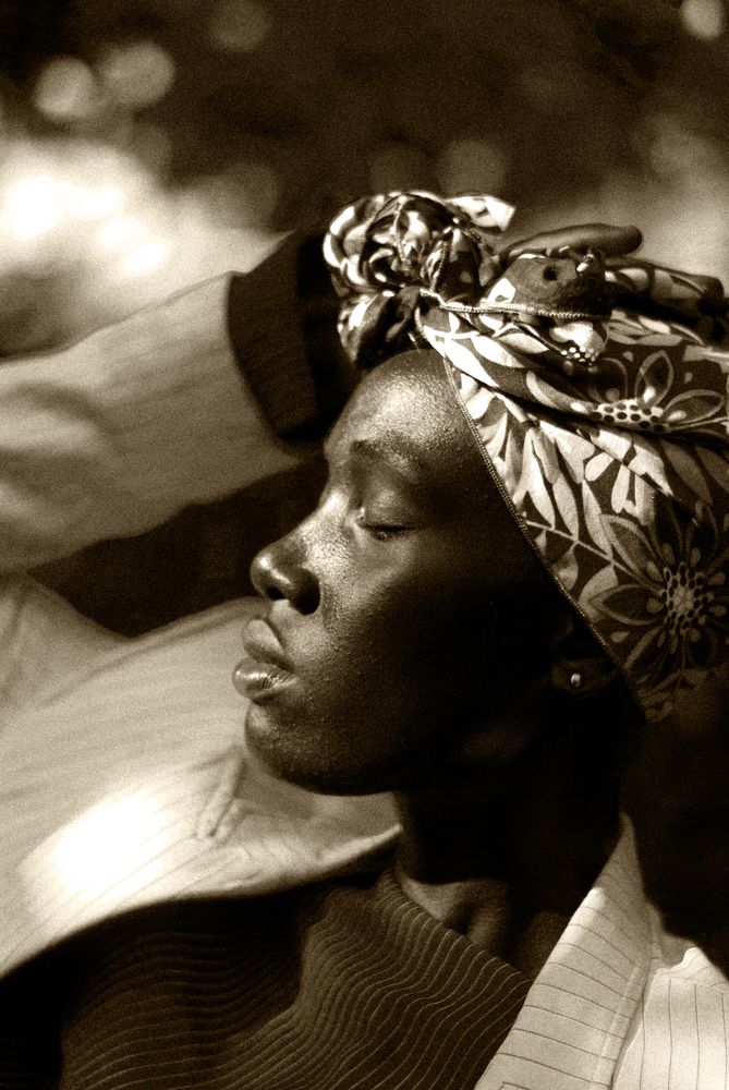 Grayscale photo of woman wearing floral head bandana