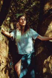 young woman near tree