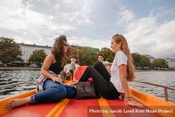 Two young women on pedal boat on river in the city 4dPYQ4