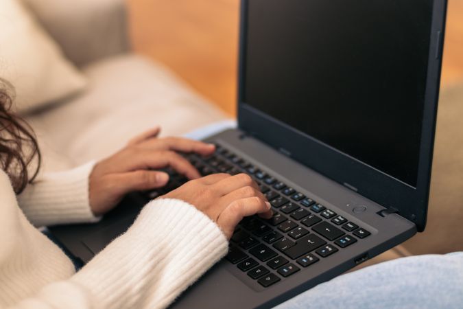 Home Productivity: Unrecognizable Woman Working on Laptop