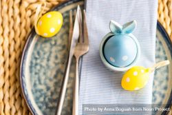 Easter holiday concept with dotted Easter eggs decorating a table setting bGR3Kv