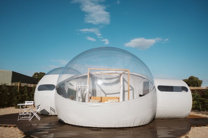 Inflatable transparent bubble hotel on summer day