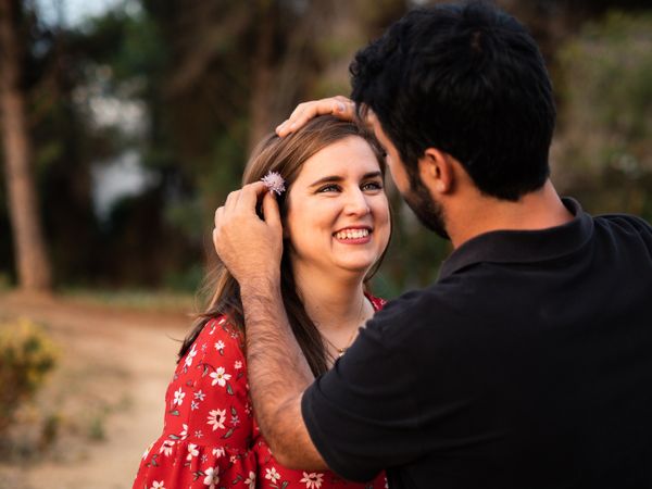 Young happy couple embracing in beautiful garden