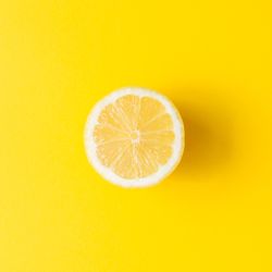 Lemon on yellow background